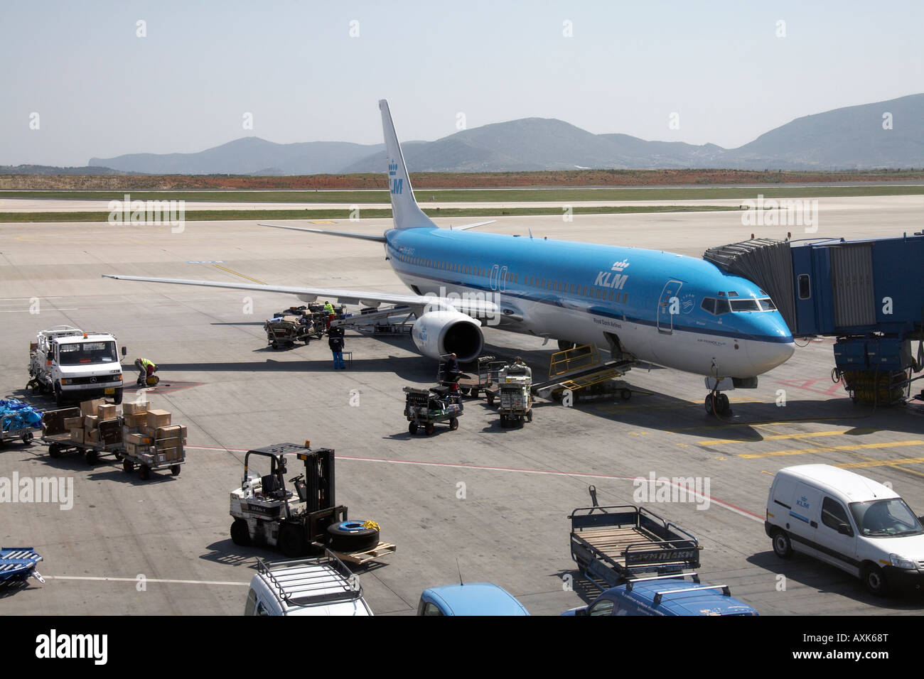 KLM Royal Dutch Airlines Boeing 737 9K2 on the apron by jetty with ground servicing handling at Eleftherios Venizelos Athens Air Stock Photo