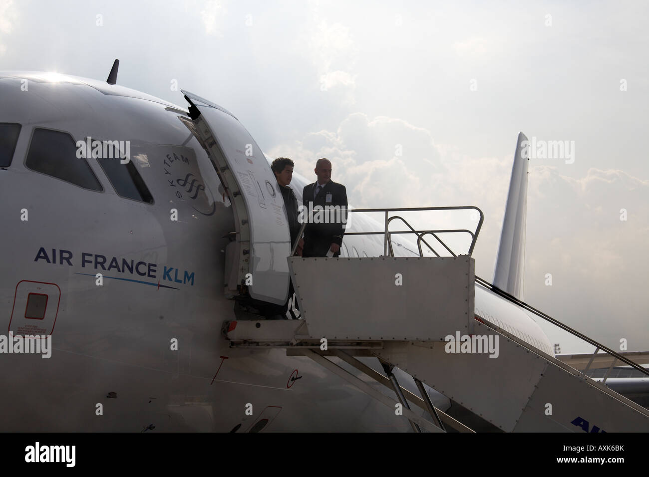 Air France crew standing on top of steps of Airbus A320 at Charles De Gaulle International Airport Paris France Stock Photo