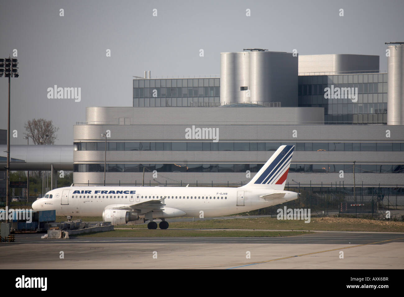 Air France Airbus A320 211 taxiing in front of modern buildings at Charles De Gaulle International Airport Paris France Stock Photo