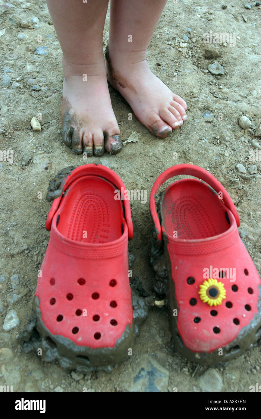 Sequel Woods Tears Girl with bare feet and red crocs Stock Photo - Alamy