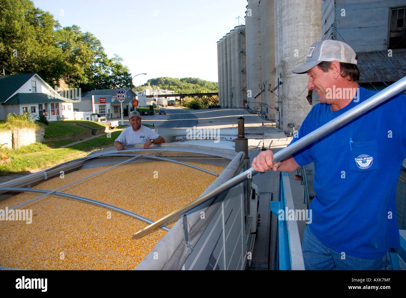 A worker sampling corn for moisture content at a grain elevator in