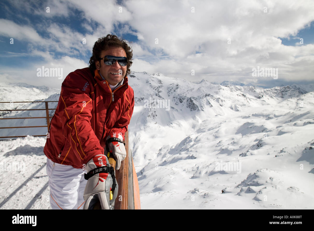 Handsome man Italian style wearing ski sportswear on top of cimino mountain  in the Alps, Bormio, Italy Stock Photo - Alamy