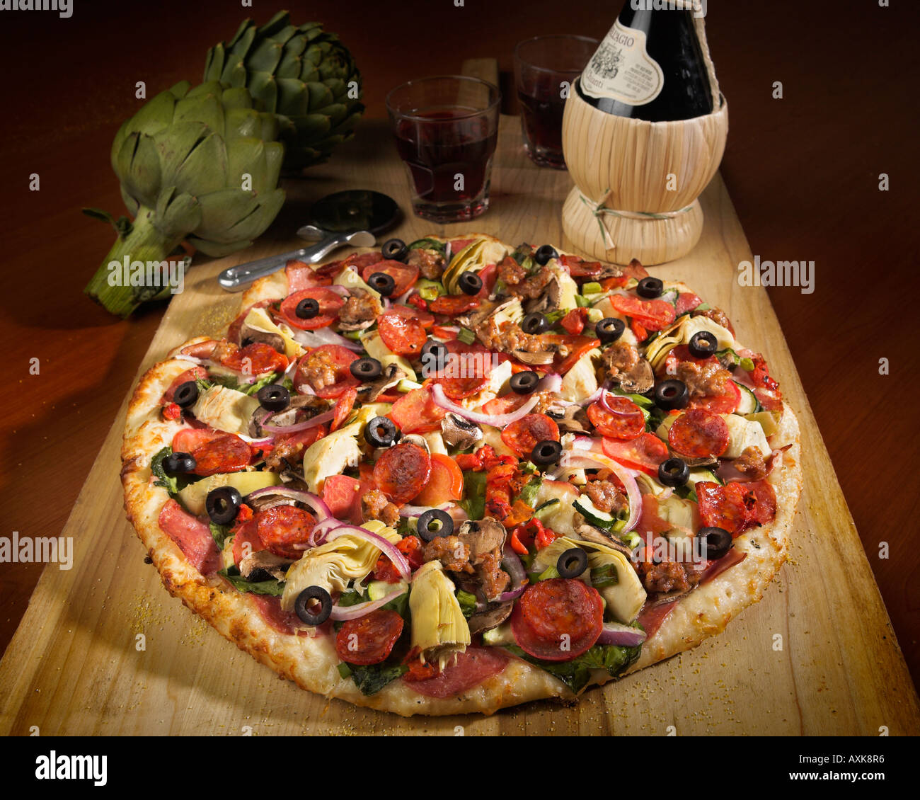 vegetable meat round circular pizza crust artichoke wine olives onions pepperoni tomato sauce