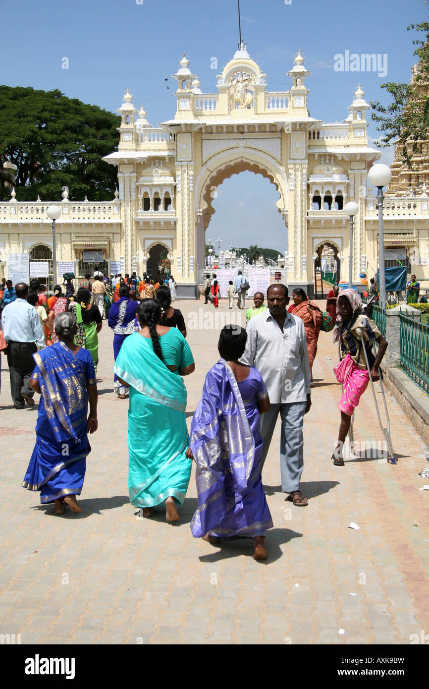 A group of Indian women are about to enter the grounds of Mysore's Amba Vilas Palace better known simply as Mysore Palace. Stock Photo