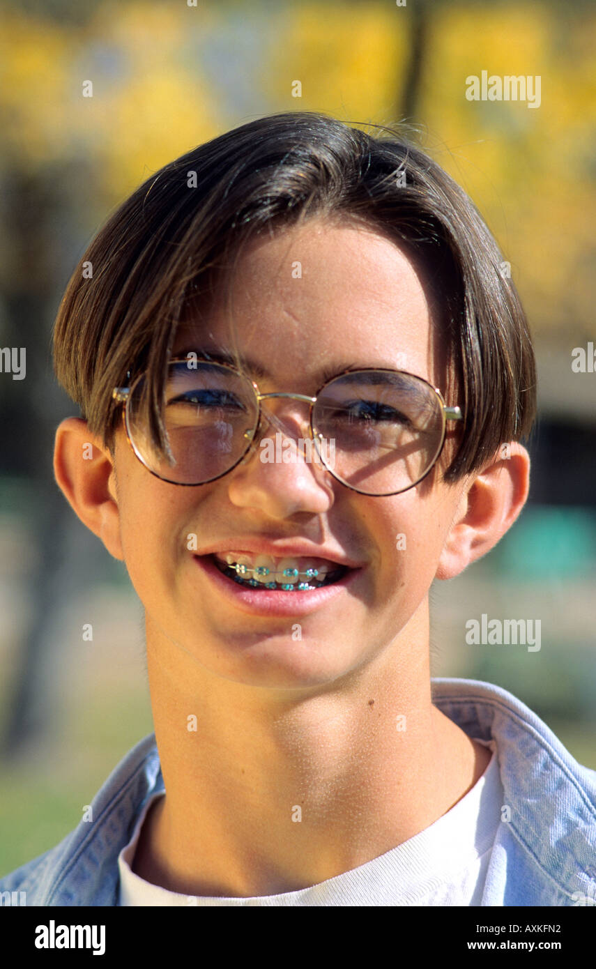American teenage boy wearing eye glasses and braces on his teeth Stock