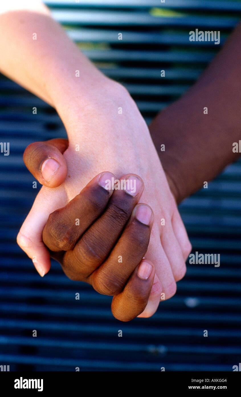 Interracial couple holding hands. Stock Photo