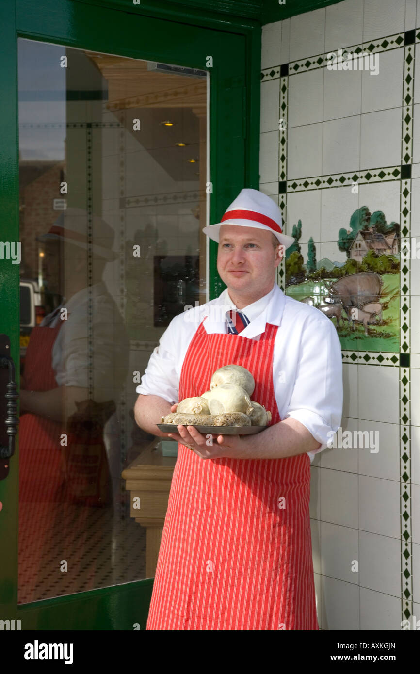 Butcher standing in Shop Doorway wearing Red Apron W Irvine Butchers  Blairgowrie, Scotland UK Stock Photo - Alamy