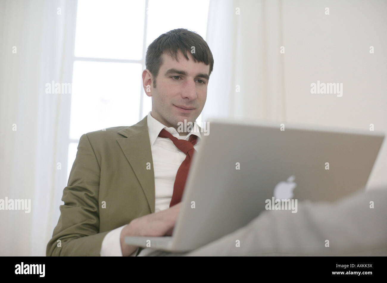 Symbols of application A young man relaxes Stock Photo