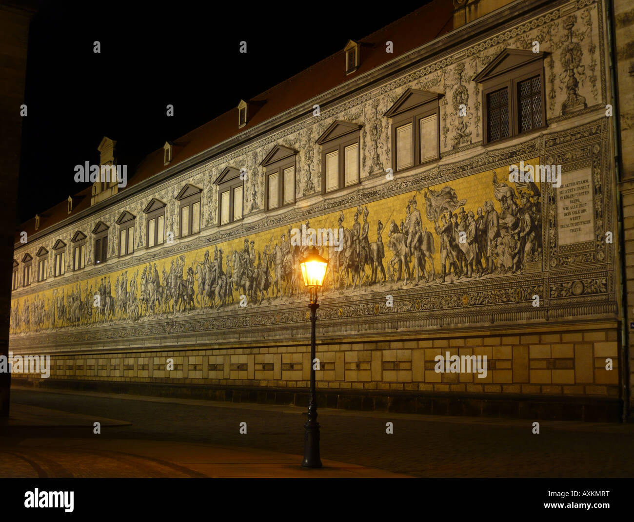 The artwork 'Fürstenzug' in the old town of Dresden at night. Stock Photo