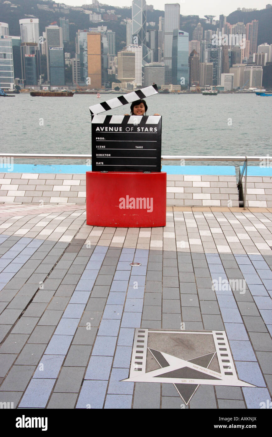 A child enjoying a prop on the 'Avenue of Stars' along the waterfront in Hong Kong,China Stock Photo