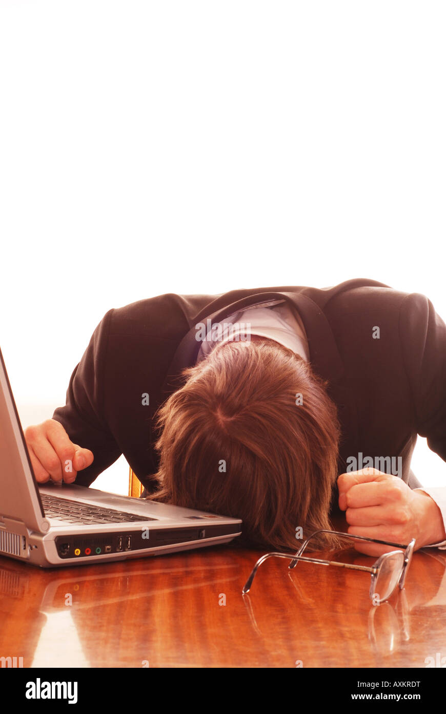Man sleeping at work on the computer Stock Photo