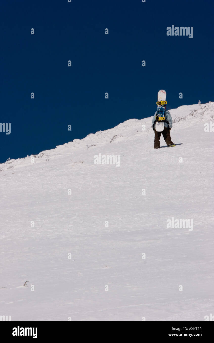 The climb to the top of Niseko Annupuri, Japan  is done on foot and is a tirening experience which is rewarded with great views. Stock Photo