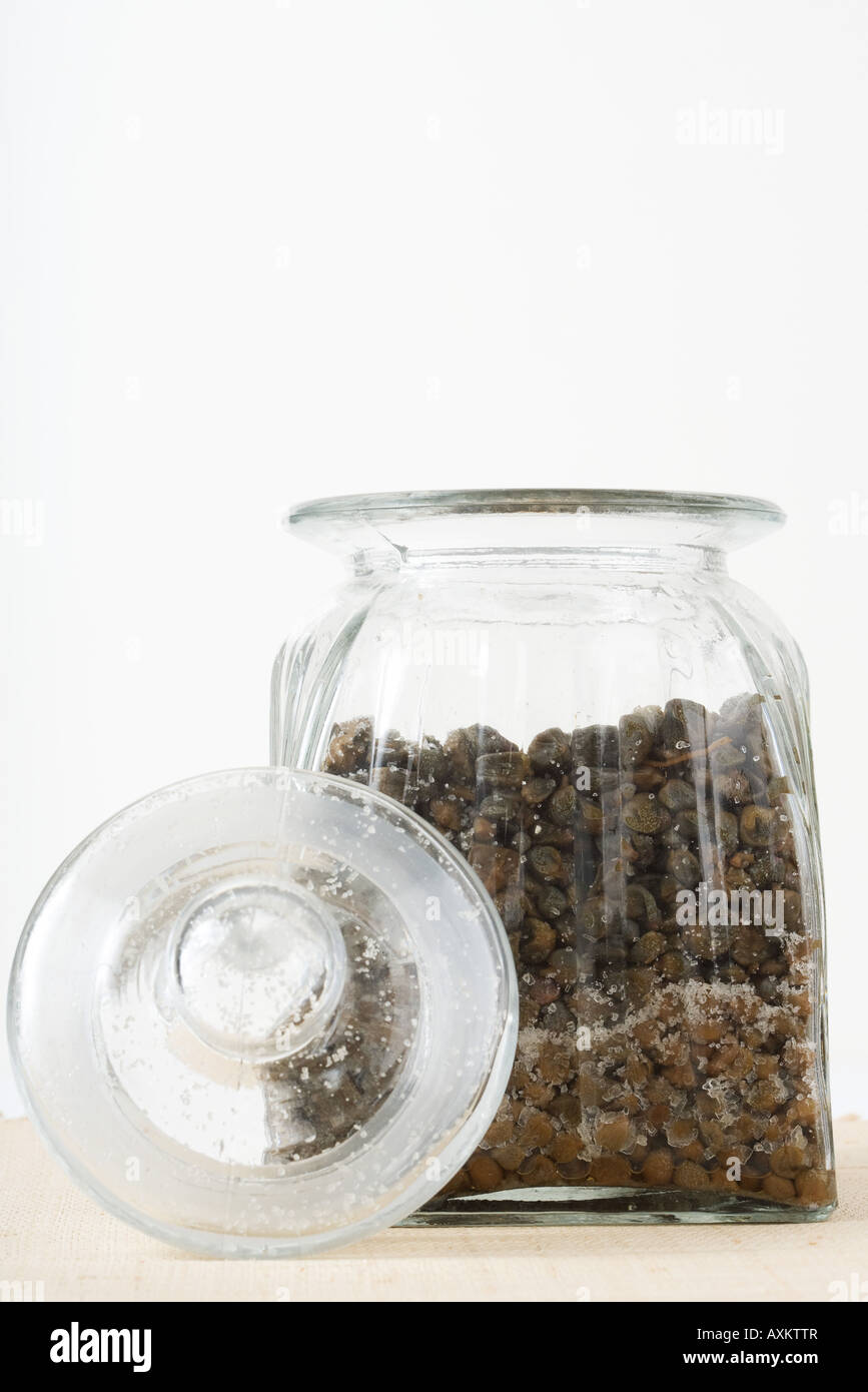 Capers and salt in jar, closeup Stock Photo Alamy