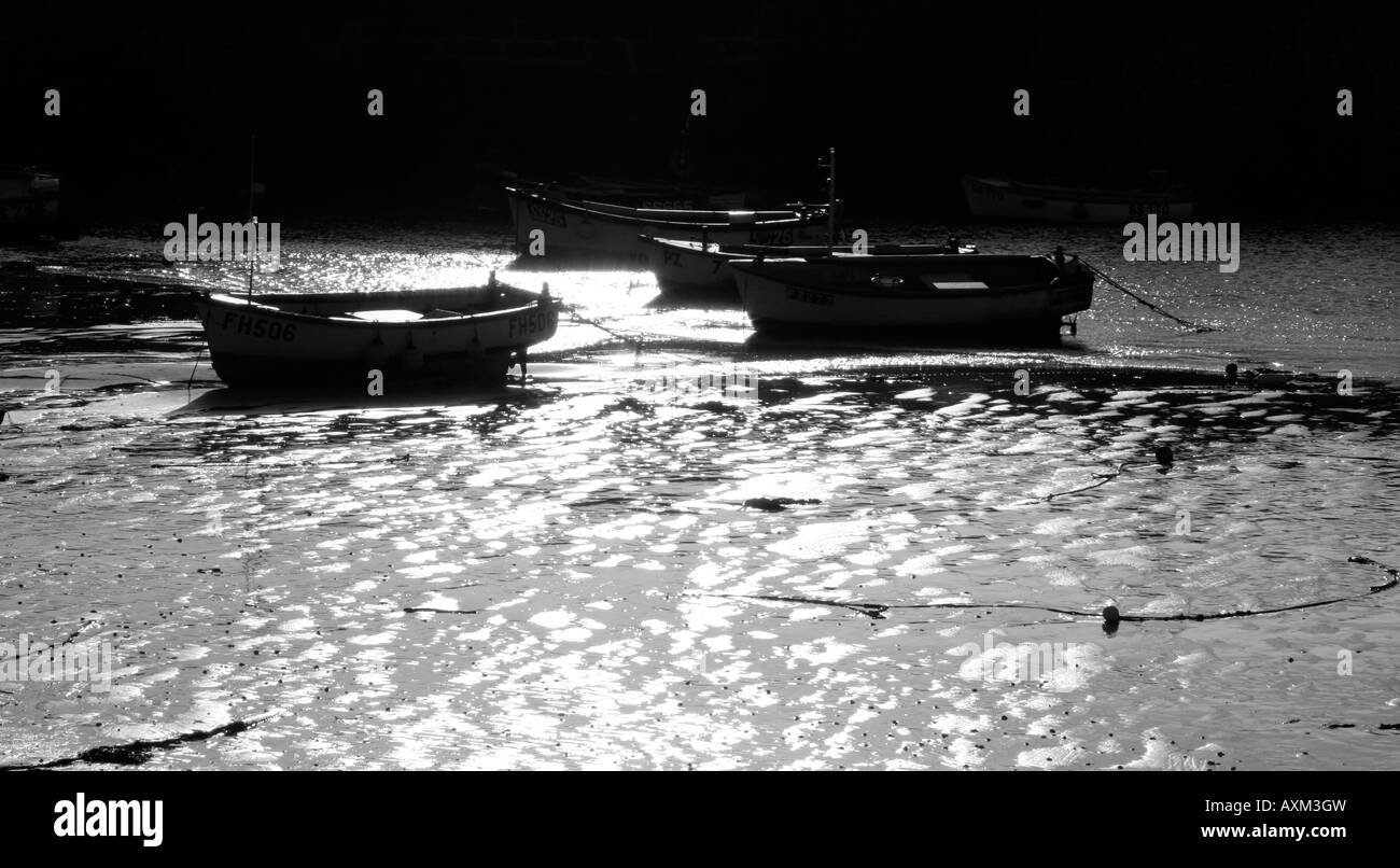 Boats at low tide in the harbour of St Ives in Cornwall Stock Photo