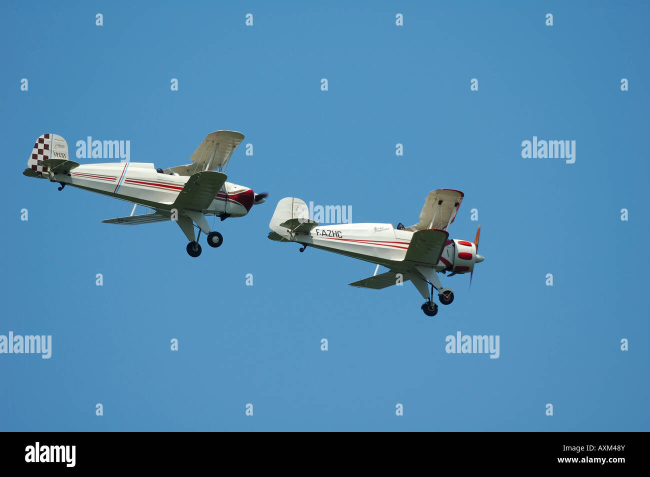Old 30's German biplanes  Bucker Bu 131 Jungmann (left) and Bucker Bu 133 Jungmeister (right), air show, La Ferte Alais, France Stock Photo