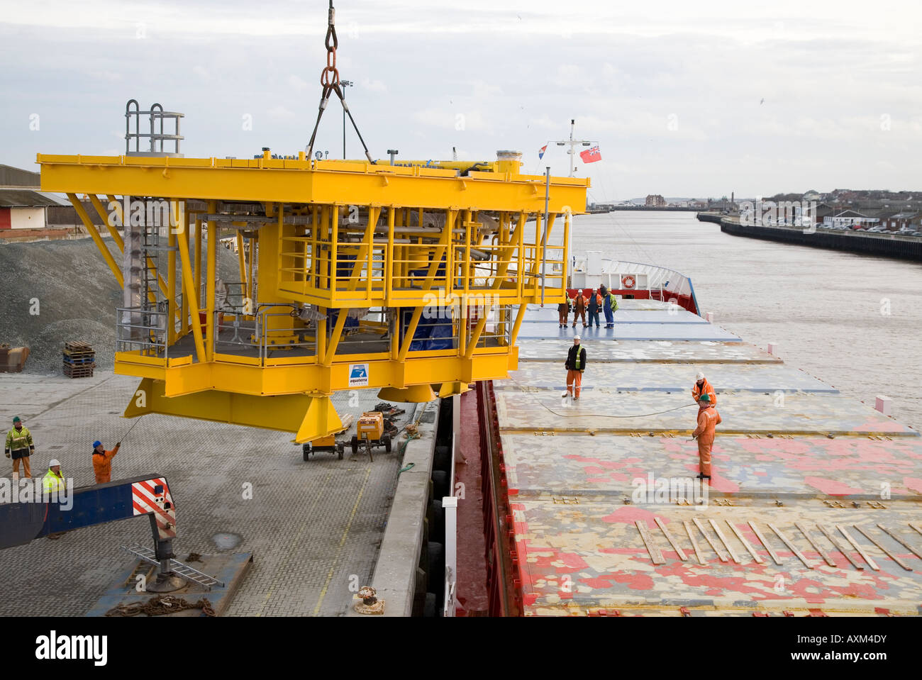 Rig platform being loaded onto container ship at Yarmouth Stock Photo ...