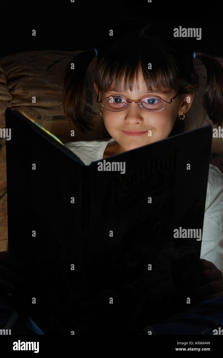 Girl Reading Magic Book Stock Photo Alamy