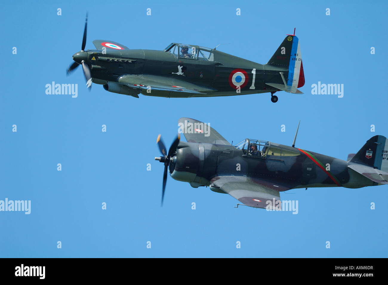 Old WWII fighter : down, Curtiss Hawk H 75 and up Morane D-406 (also ref D-3801) during french vintage air show, La Ferte Alais Stock Photo