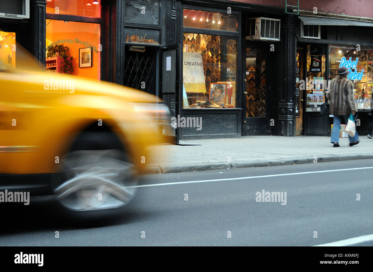 Taxi moving on Bleeker Street Greenwich Village New York City USA Stock Photo