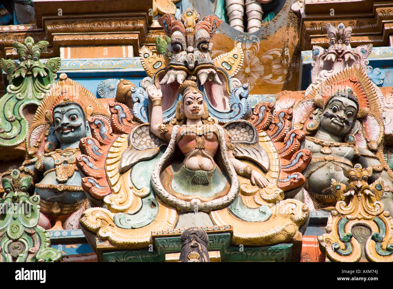 Carved Hindu figures on a gopuram, Meenakshi Temple, Madurai, Tamil Nadu, India Stock Photo