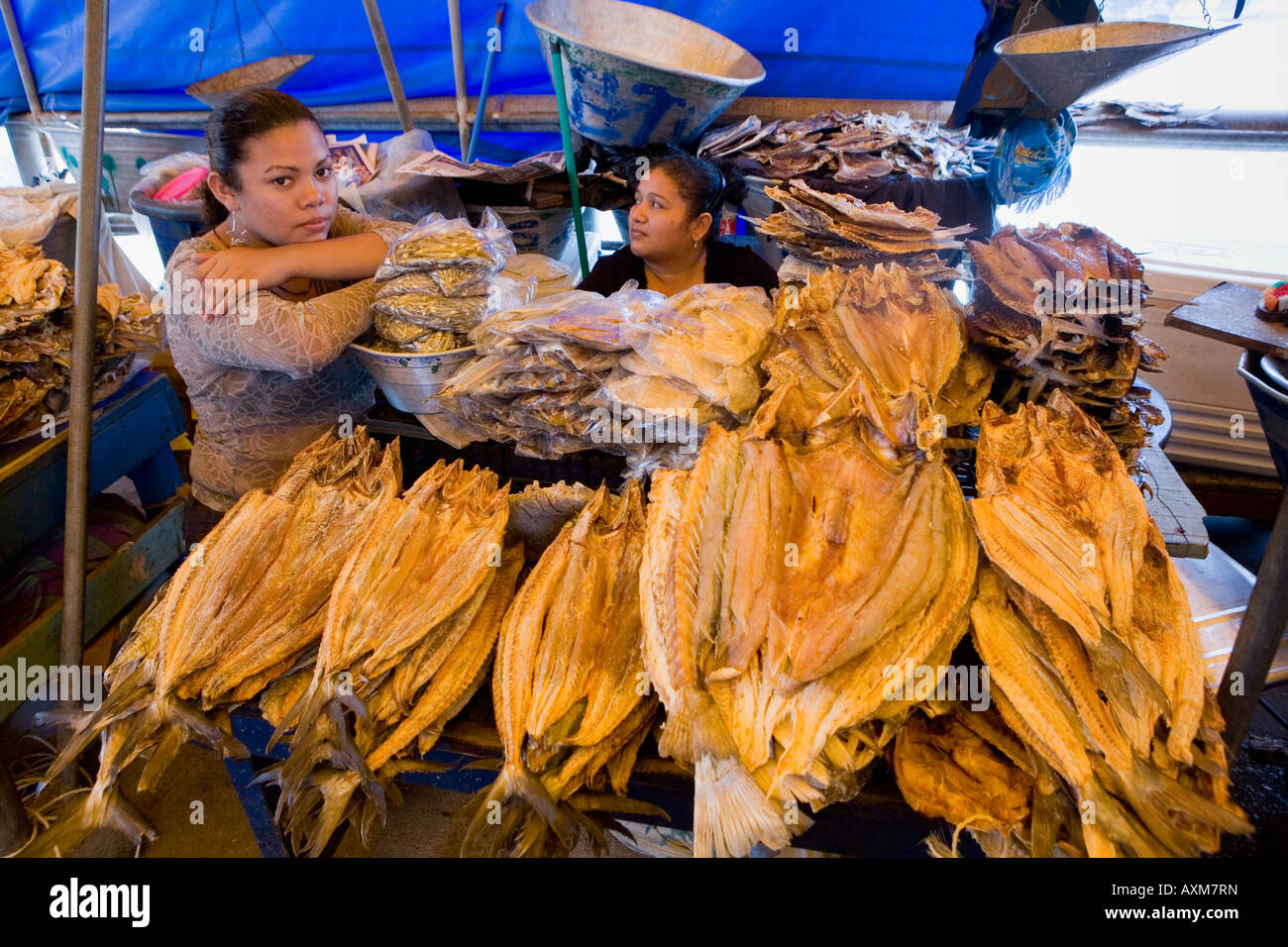 Women selling dried fish on pier market fishing village of La Libertad