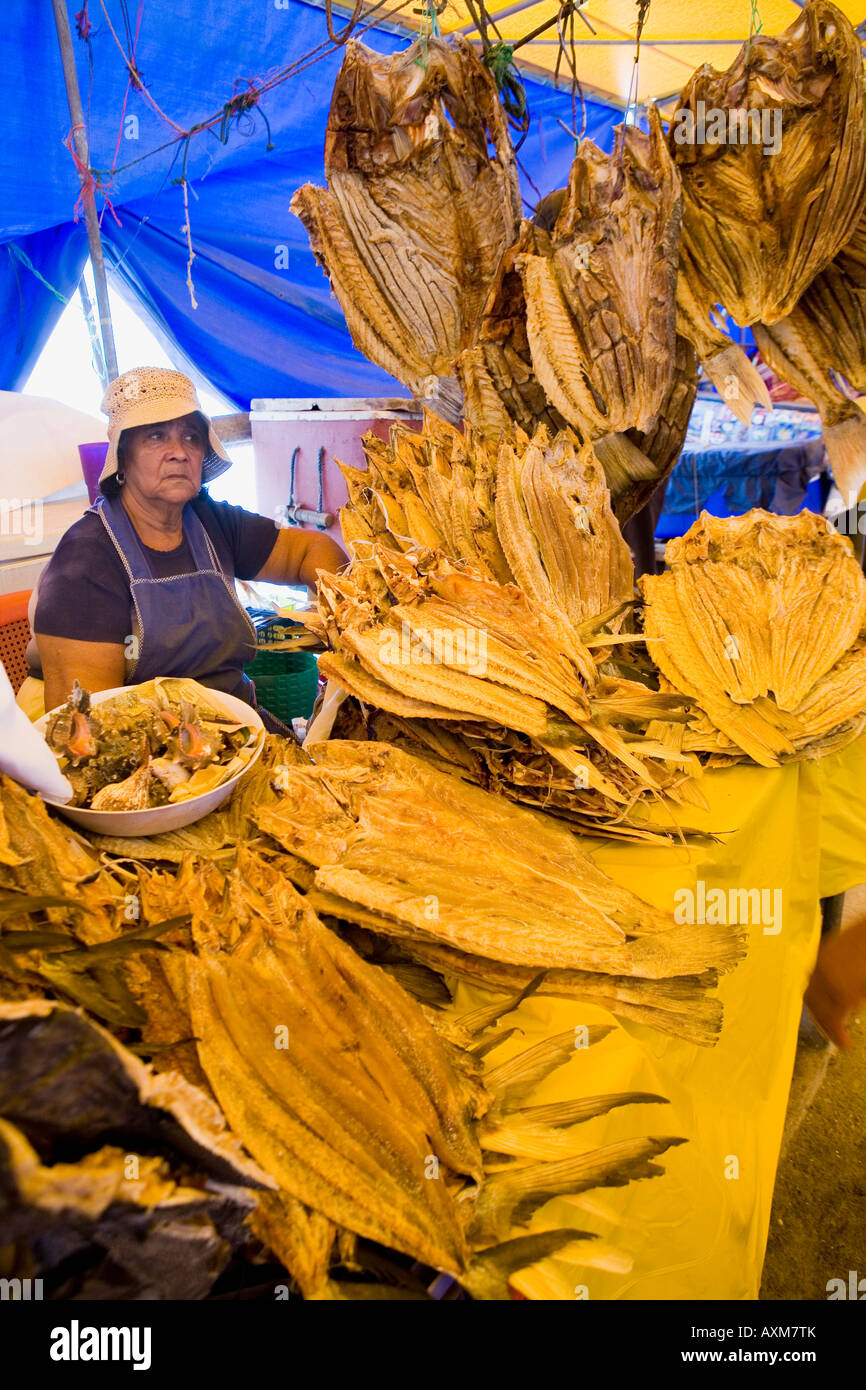 Woman selling dried fish on pier market fishing village of La Libertad
