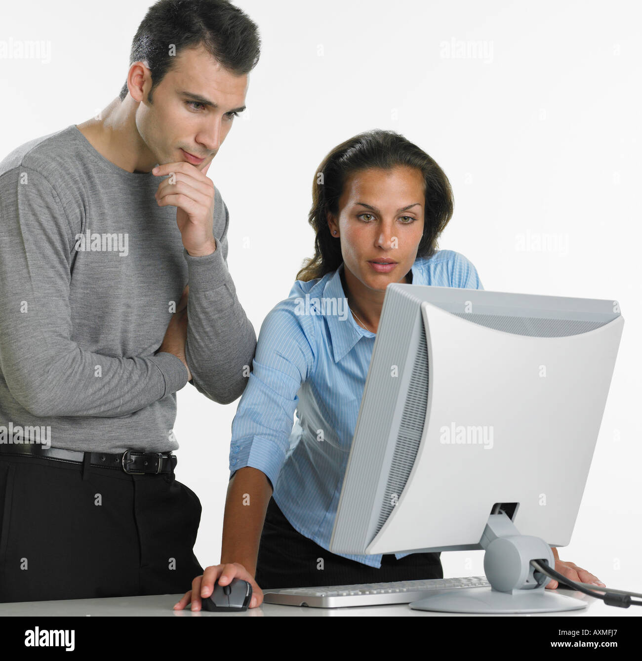 Businesswoman and businessman using computer Stock Photo