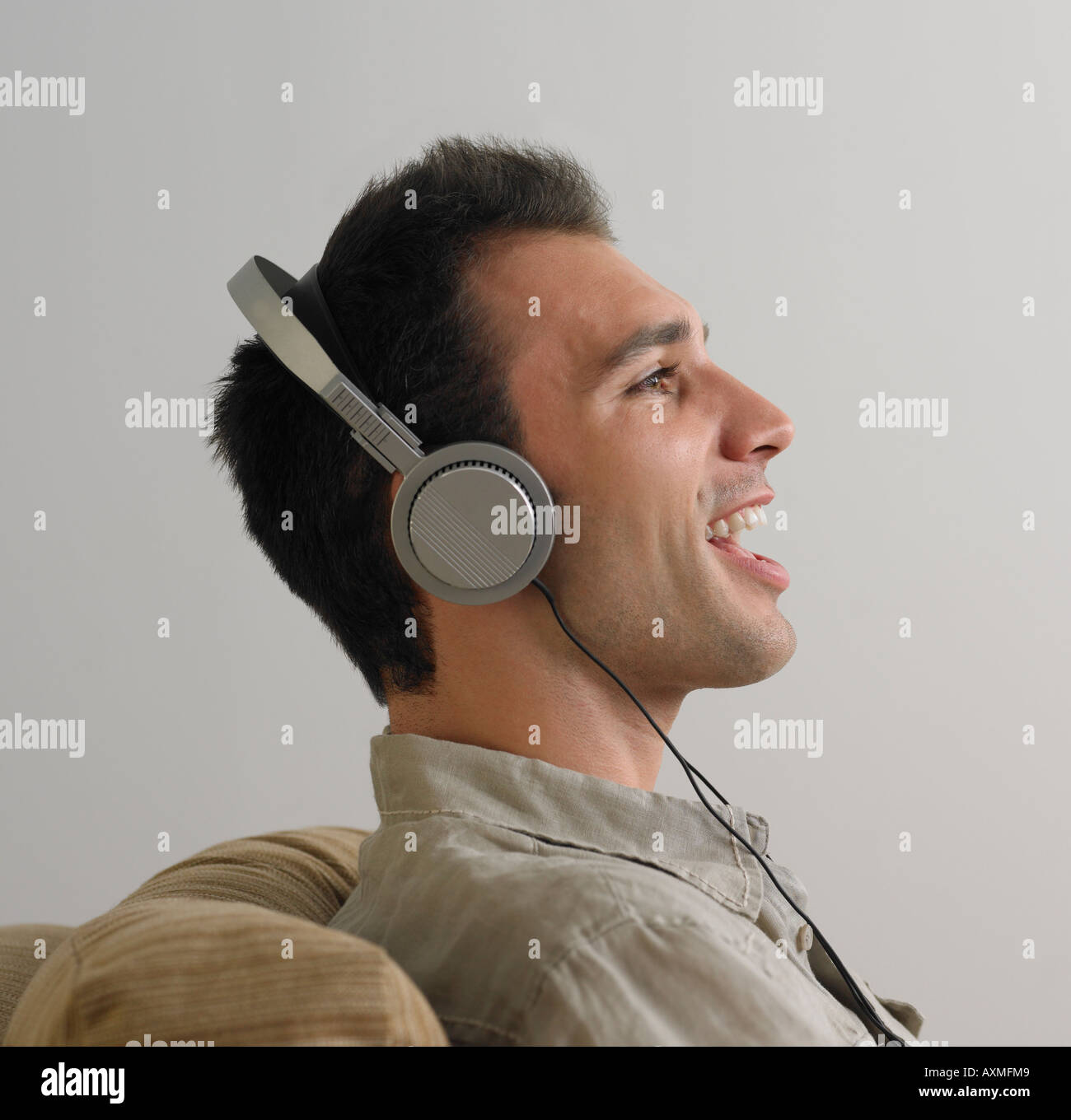Man sitting and listening to music on headphones Stock Photo Alamy