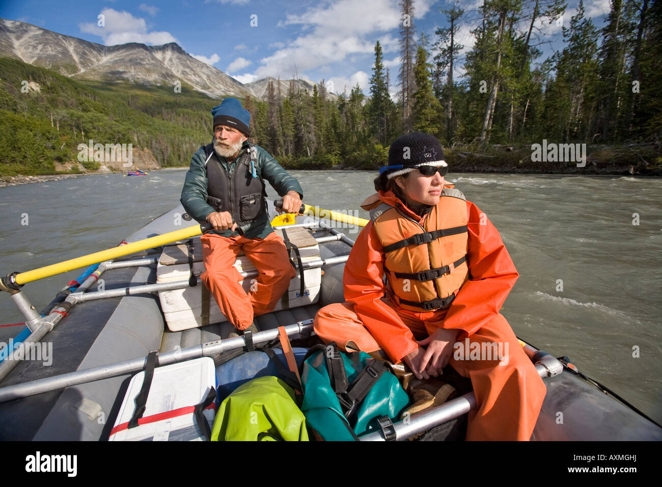 man and woman rafting on the Tatshenshini river in Canada Stock Photo