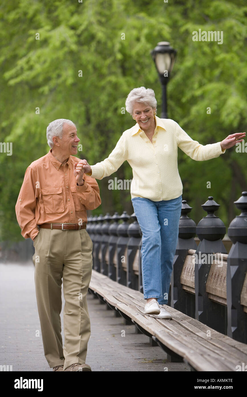 Senior woman walking in park hi-res stock photography and images - Alamy