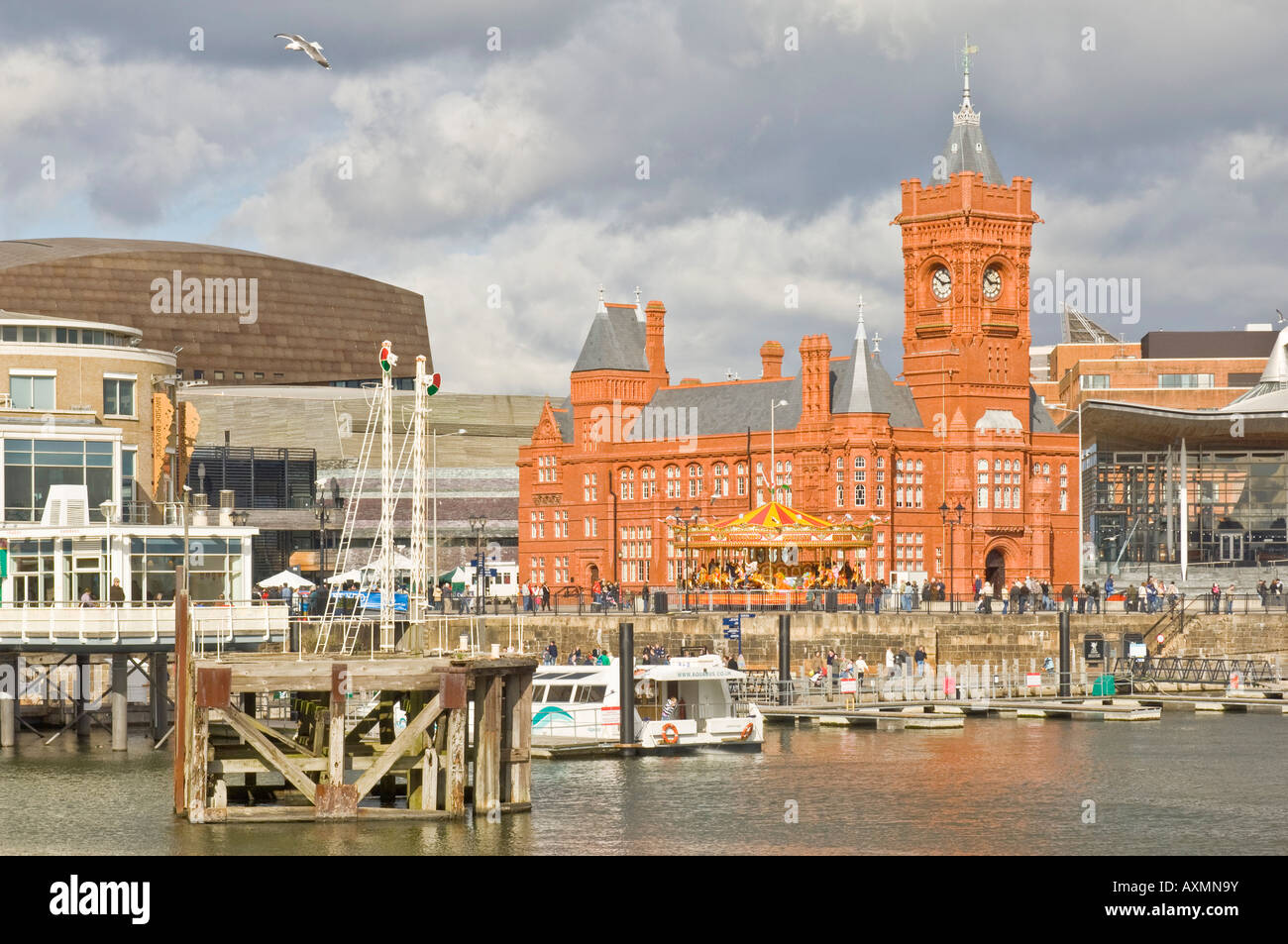 Central area of Cardiff Bay (Mermaid Quay) - a regenerated commercialised area south of Cardiff with the Pierhead Building. Stock Photo