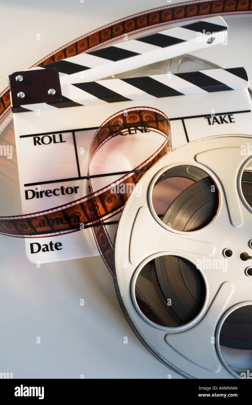 Movie reel with film and clapboard Stock Photo