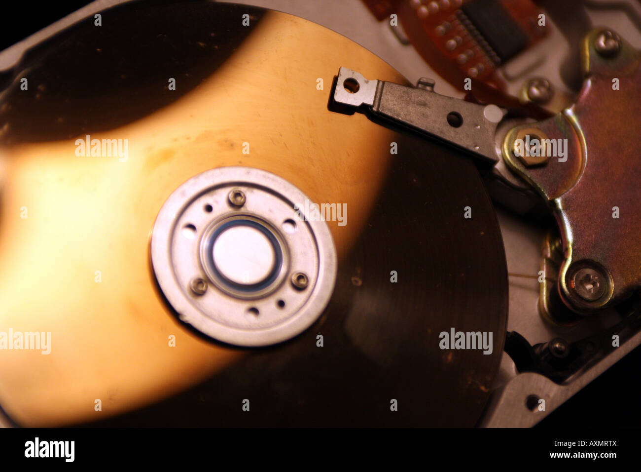 internal working of a hard disk platter plater head assembley magnetic mylar surface crash Stock Photo