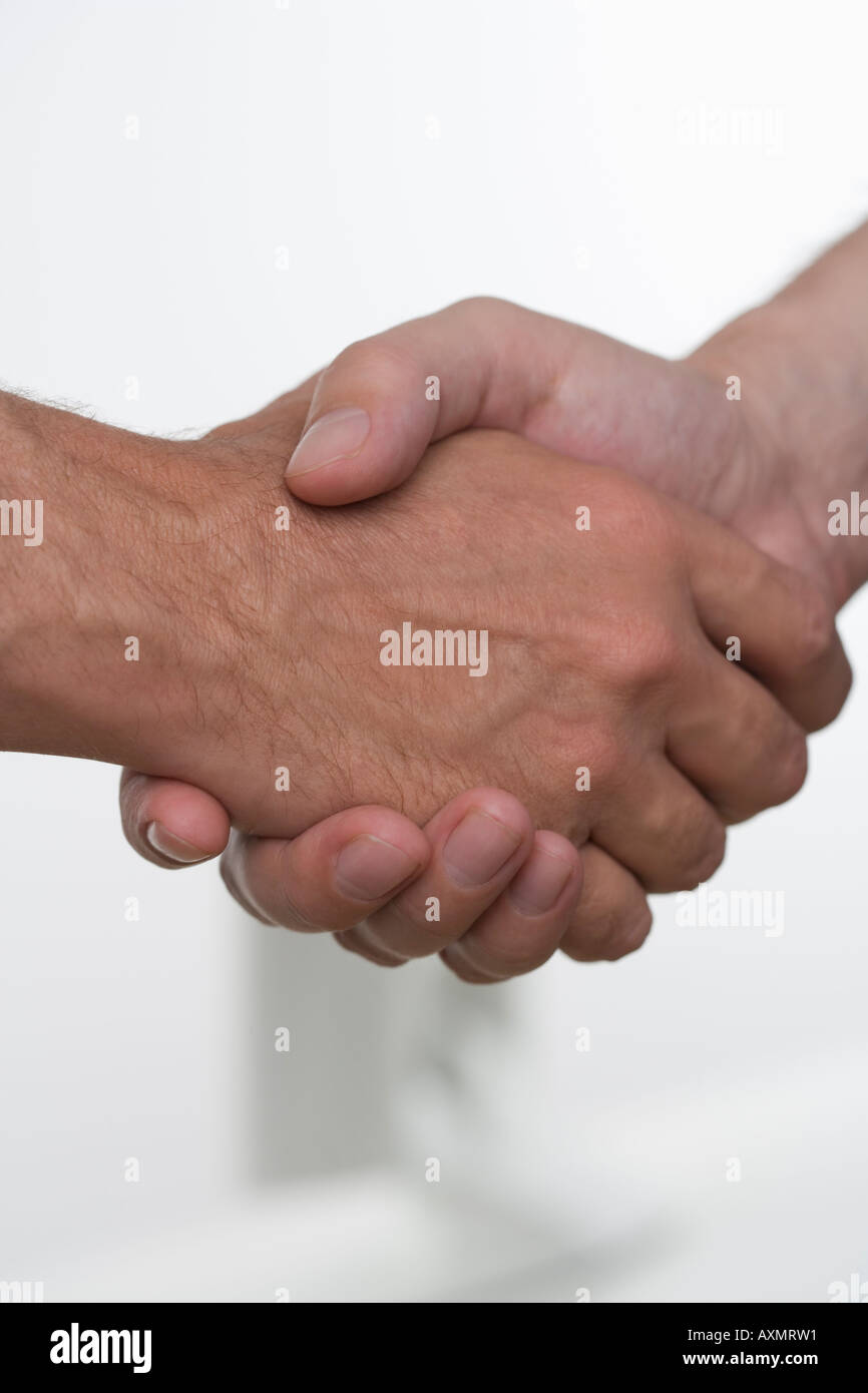 Closeup of men shaking hands Stock Photo