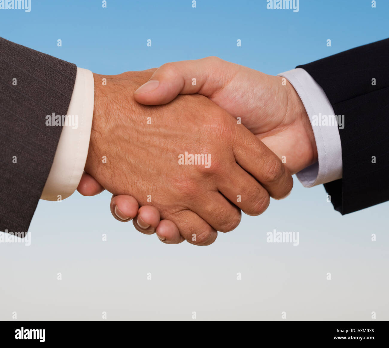 Businessmen shaking hands Stock Photo