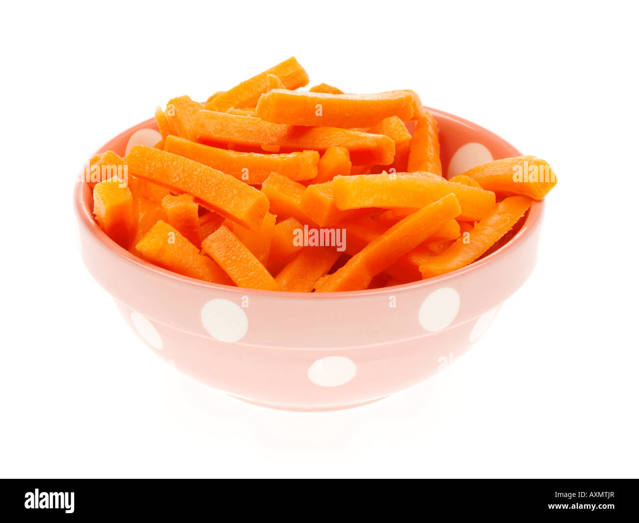 Bowl Of Fresh Healthy Prepared Carrot Batons In A Bowl Ready For Cooking Isolated Against A White Background With No People And A Clipping Path Stock Photo