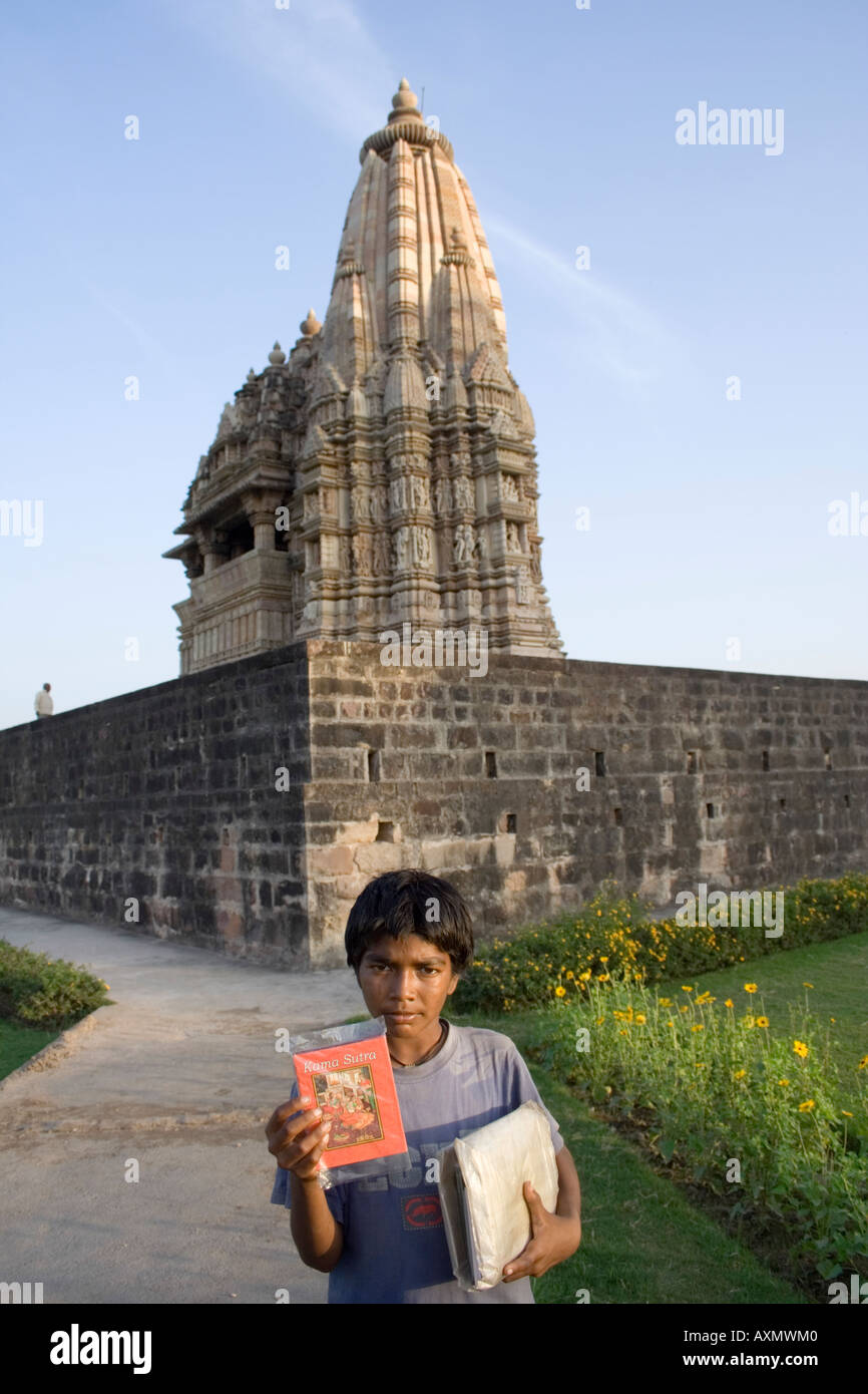 Underage boy selling Kamsutra books Stock Photo