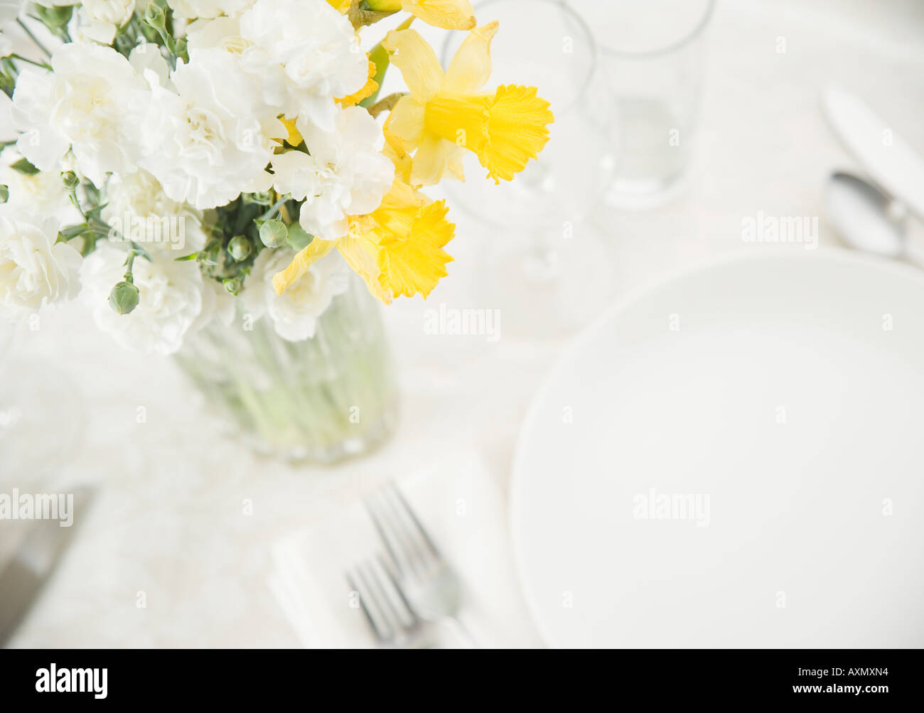 Table setting with flower arrangement Stock Photo