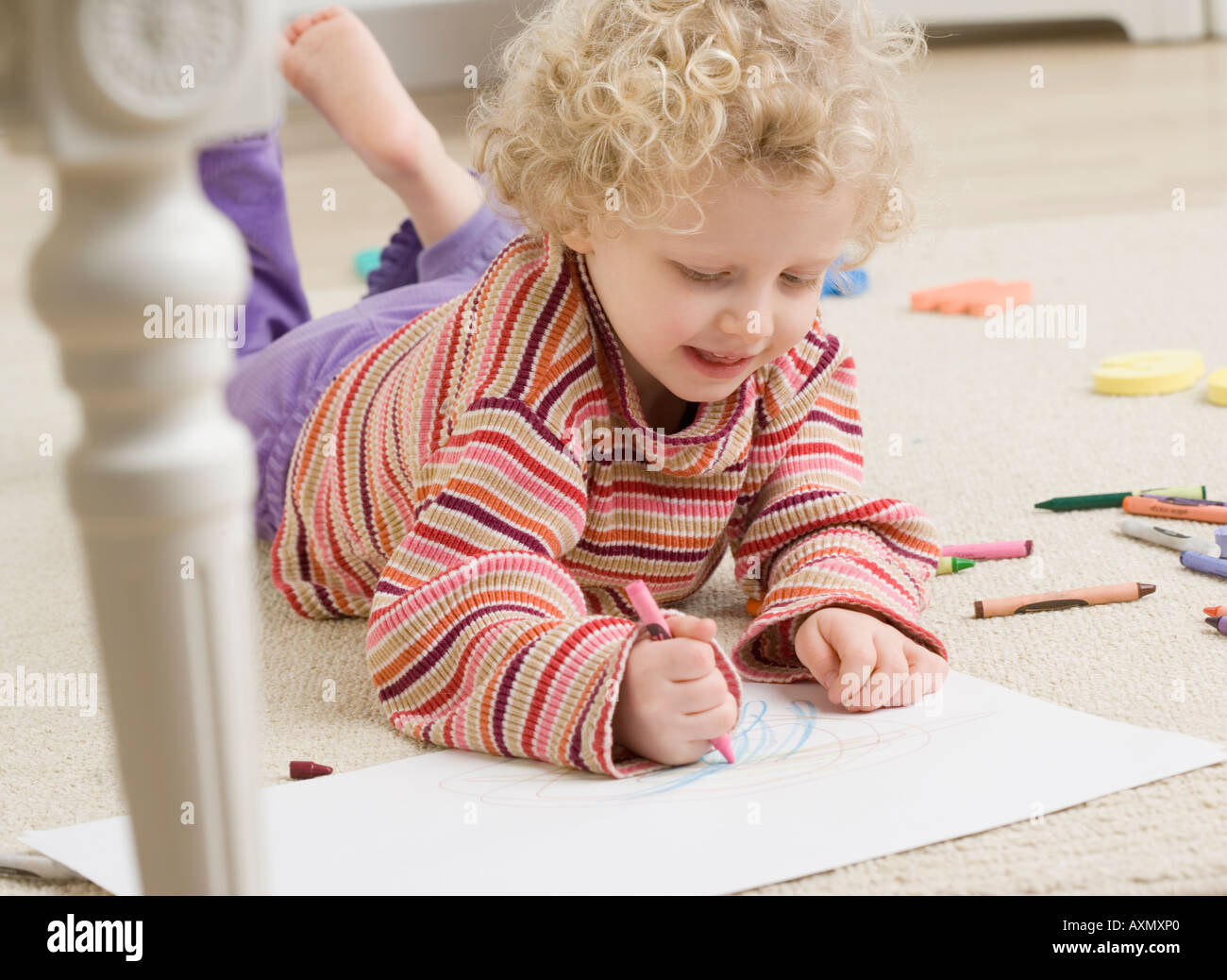 Child drawing with crayon Stock Photo - Alamy