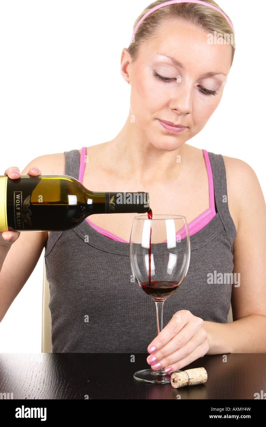 Young Woman Pouring Glass of Red Wine Model Released Stock Photo - Alamy