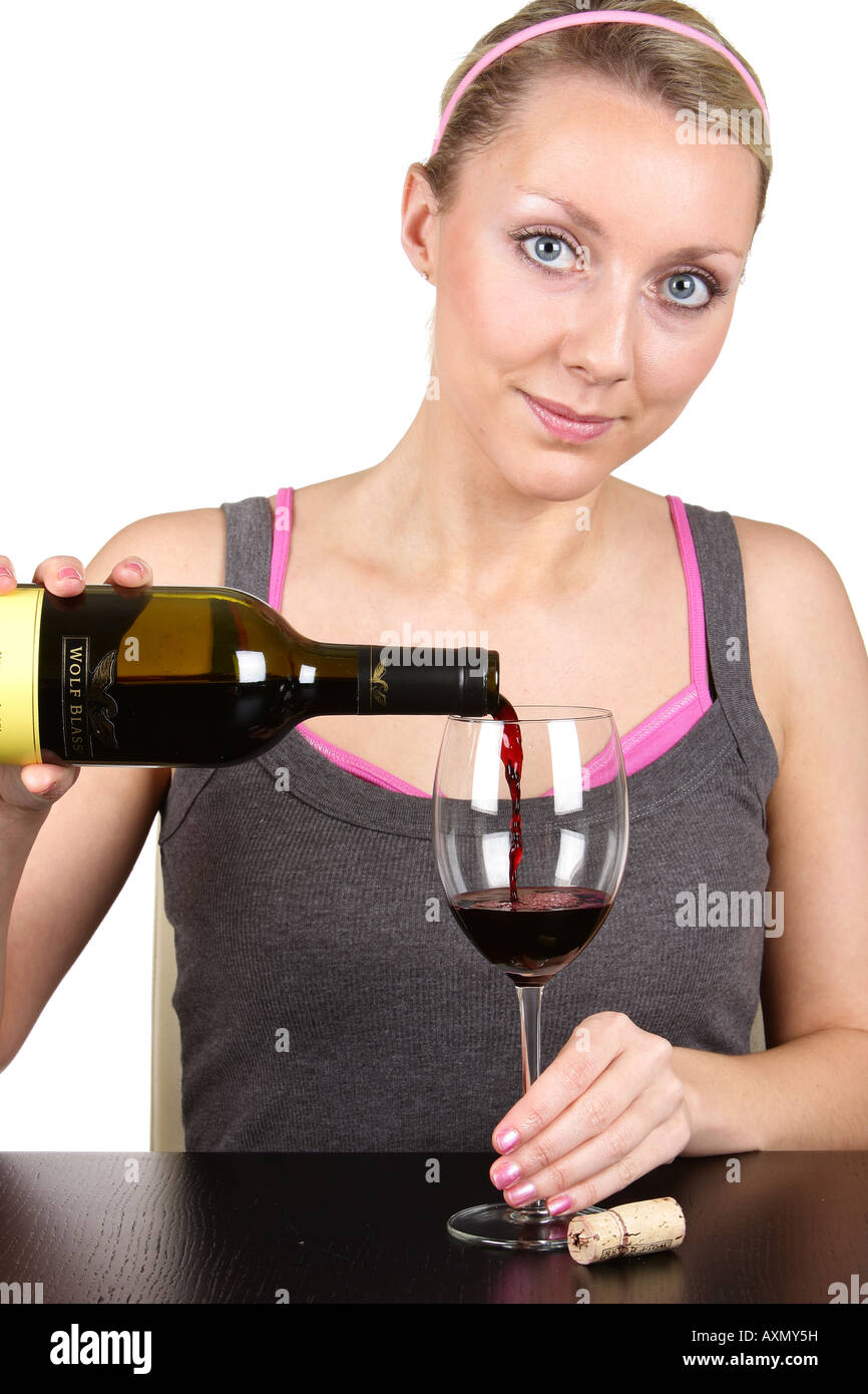 Young Woman Pouring Glass of Red Wine Model Released Stock Photo - Alamy