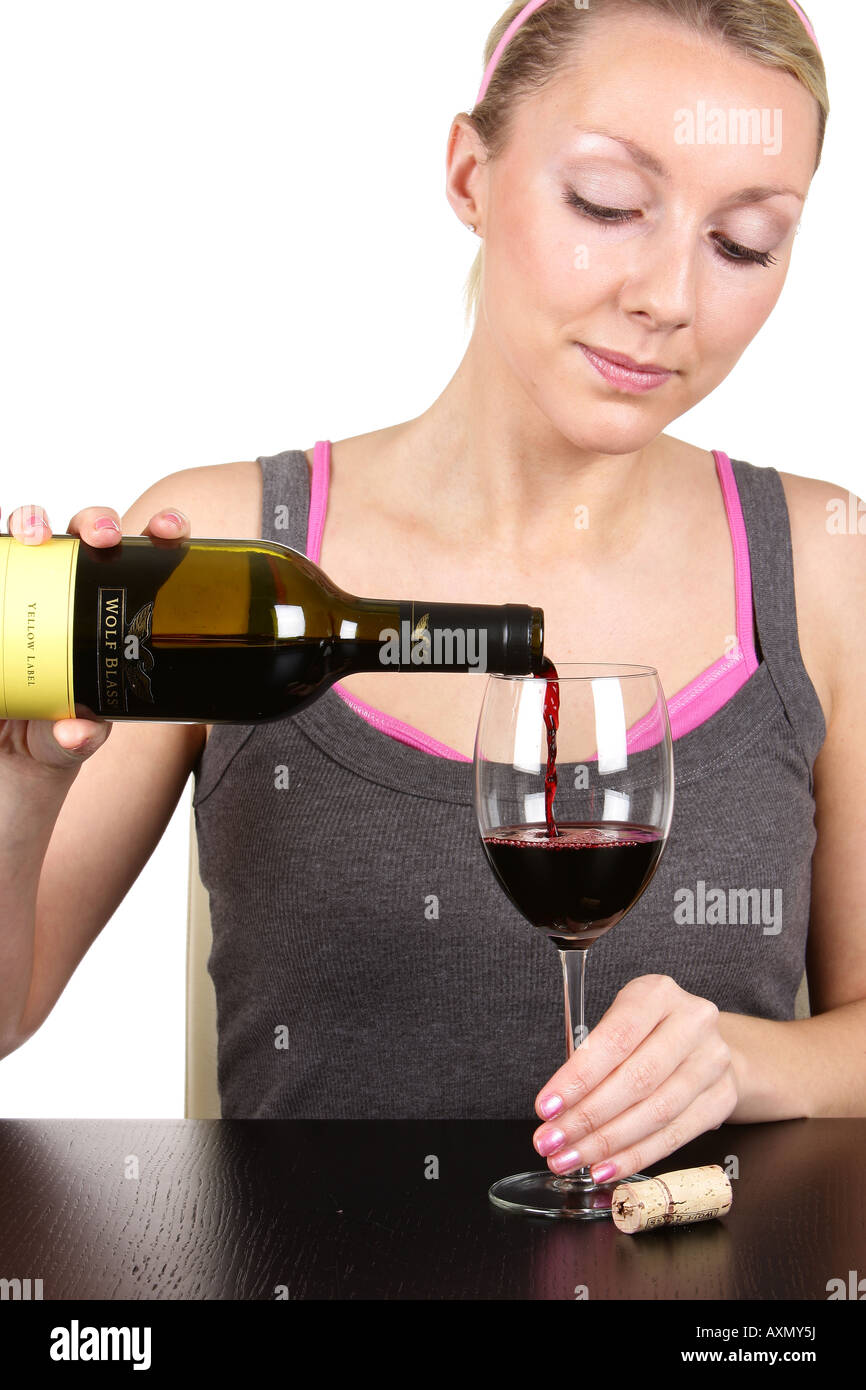 Young Woman Pouring Glass of Red Wine Model Released Stock Photo - Alamy