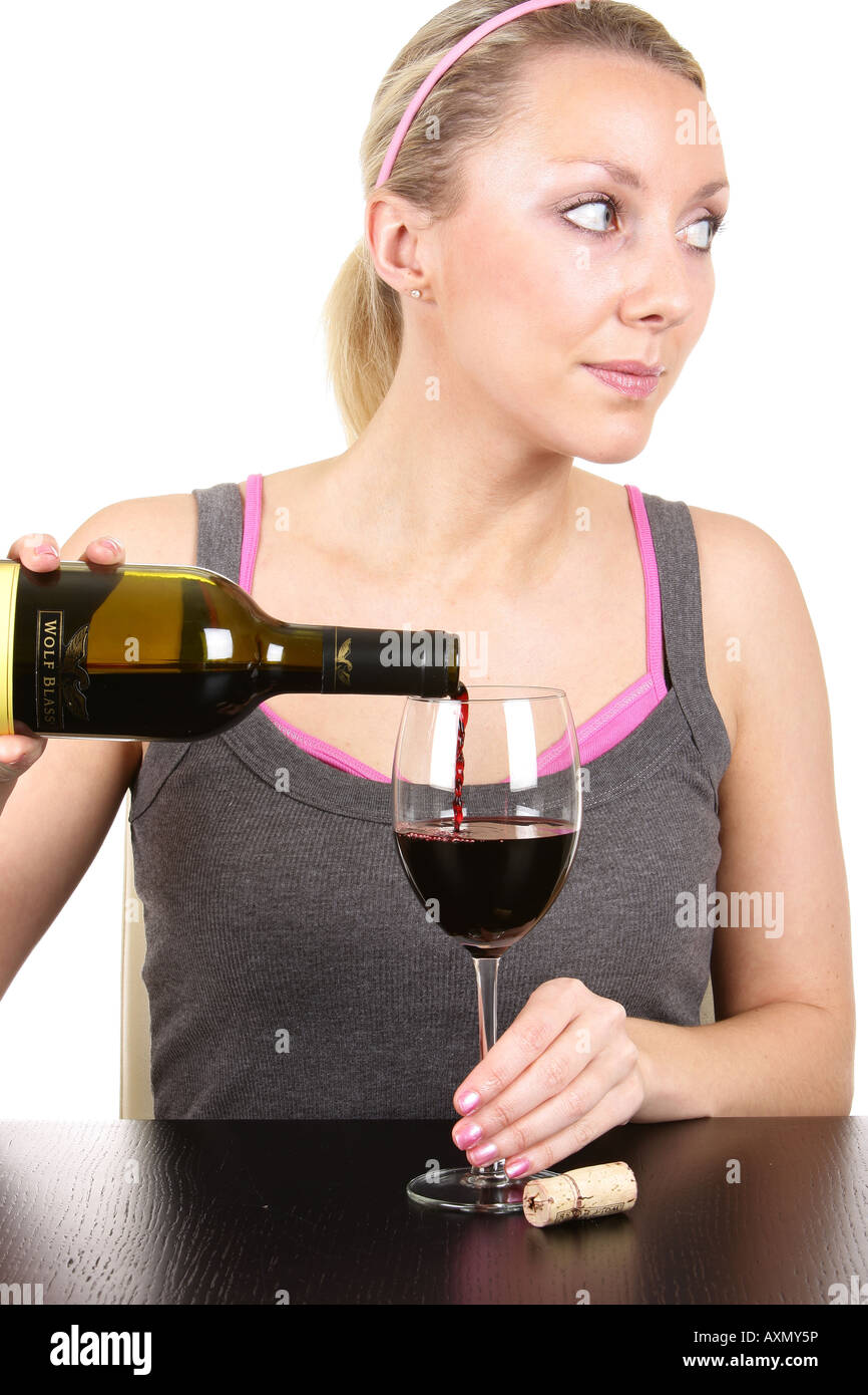 Young Woman Pouring Glass of Red Wine Model Released Stock Photo - Alamy