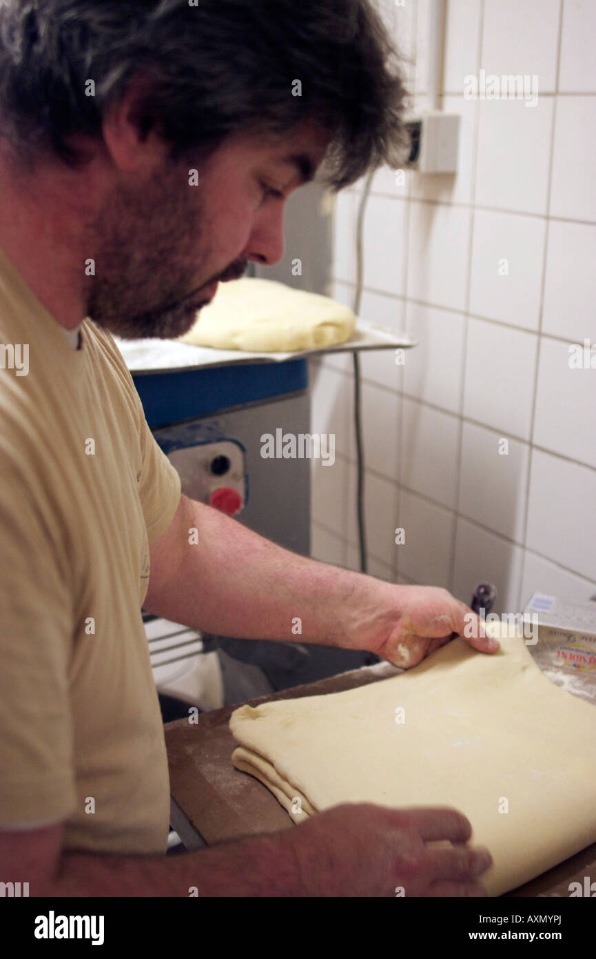 Baker Jacques Langlois making croissant dough at his bakery on rue Beauvoisine in Rouen, Seine-Maritime, France. Stock Photo
