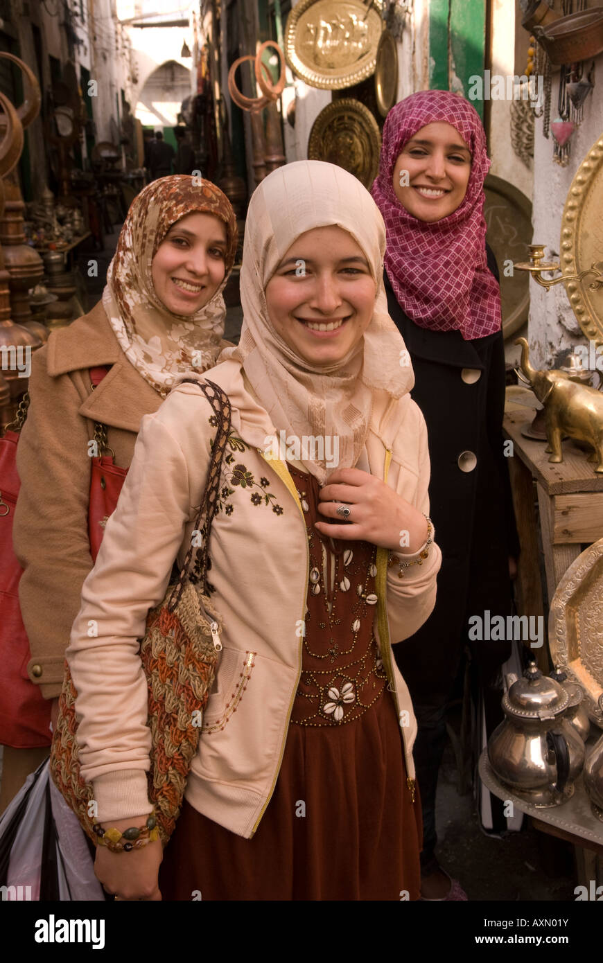 Three young Libyan women in the copper souq of the old town or medina Tripoli Libya Stock Photo