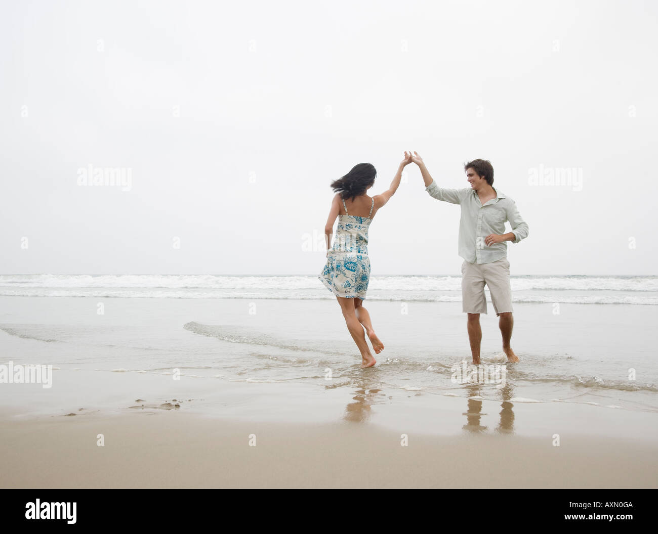 Couple dancing at beach Stock Photo - Alamy