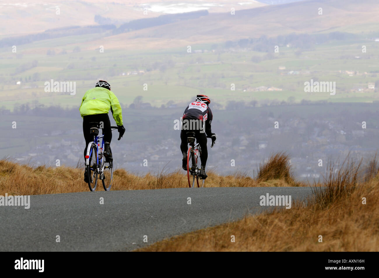 Two cyclists riding on road hi-res stock photography and images - Alamy