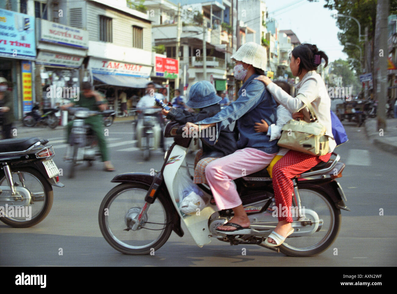 Vietnam, Four People On A Motorbike Stock Photo