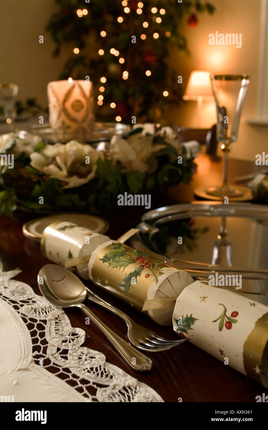 Christmas dinner table set with candle Stock Photo