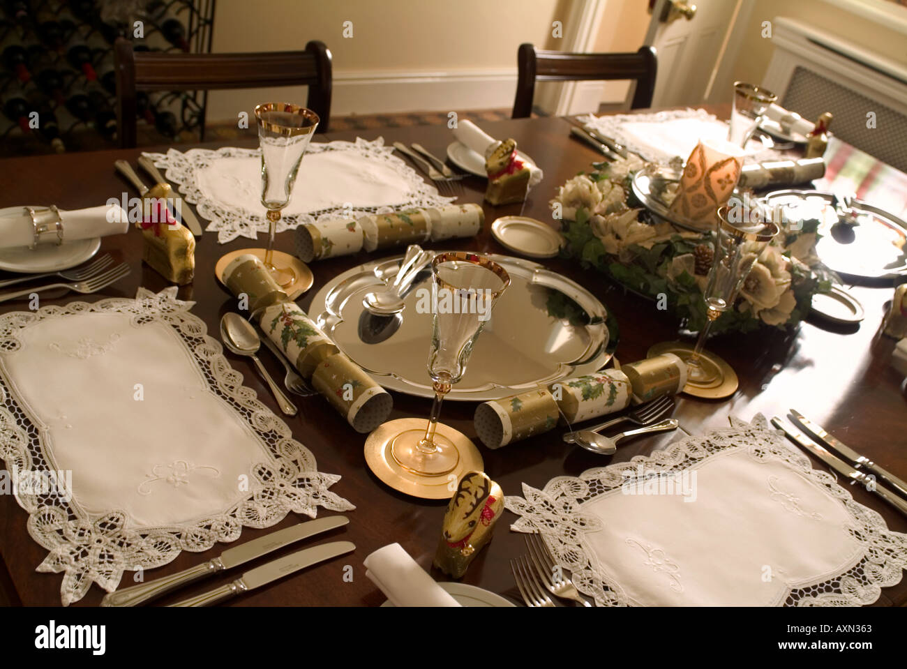 Christmas dinner table set with candle Stock Photo